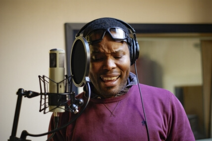 Man singing into microphone