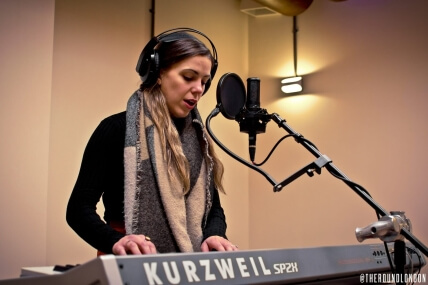 Woman playing piano keyboard